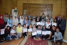 Handing the Chinese students the certificates for completing their Arabic language studies in Benha University
